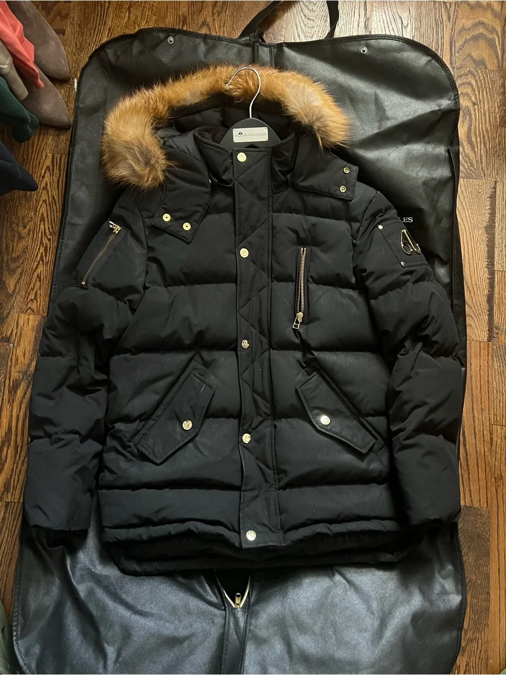 Moose Knuckles Black Winter Jacket with Gold Fur Trim And Accents